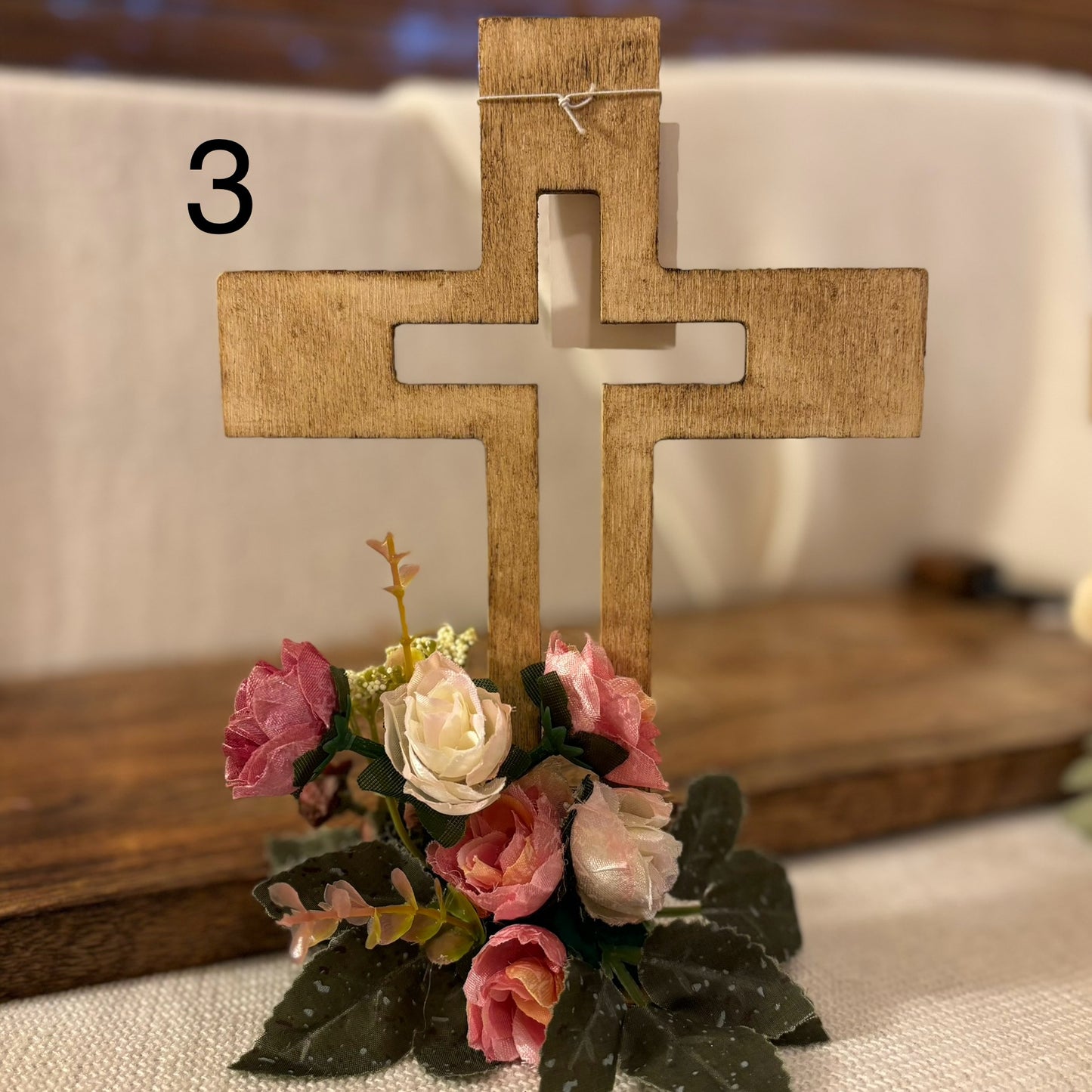 Handmade Stained or Chalk Painted Wooden Cross with Floral Arrangement at Base