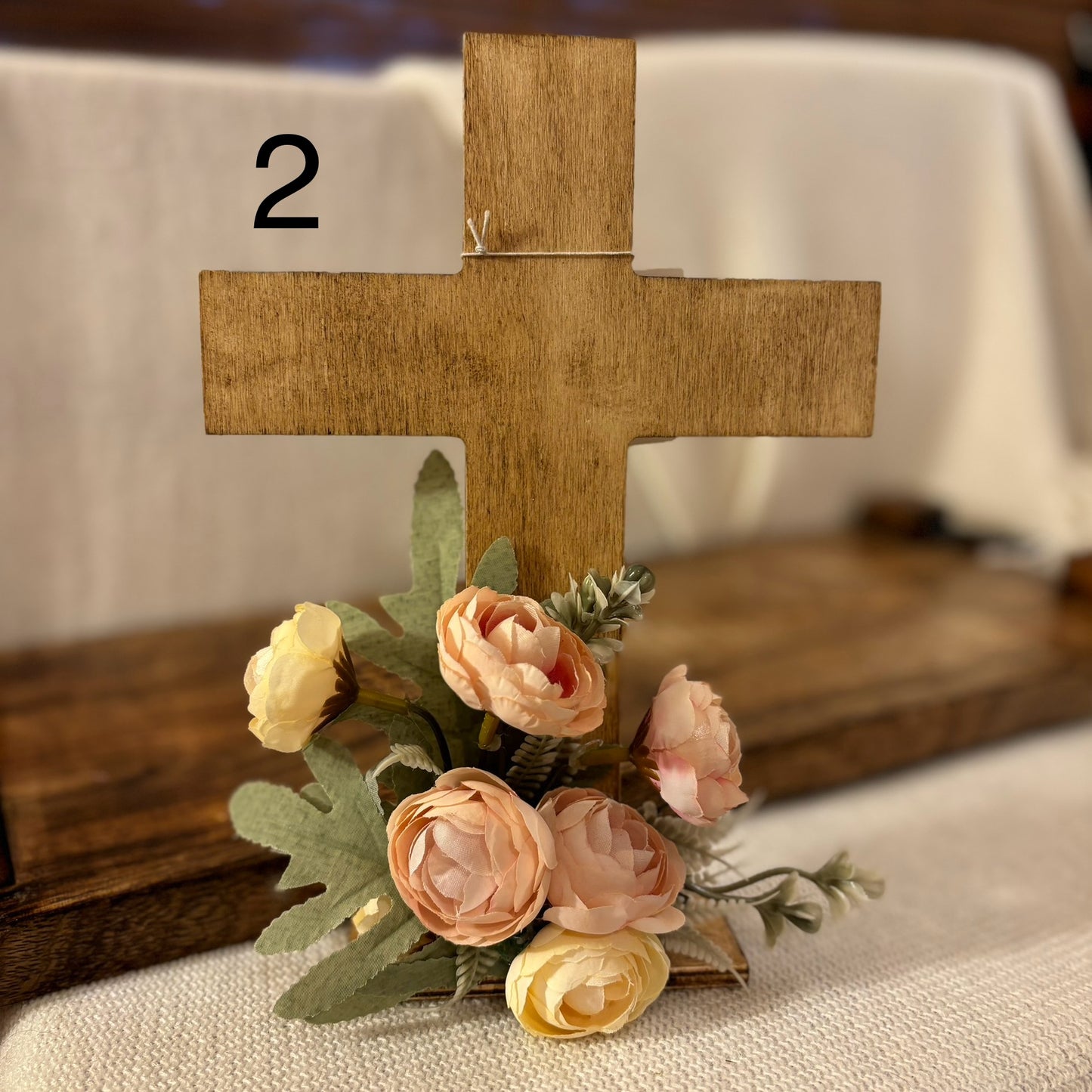 Handmade Stained or Chalk Painted Wooden Cross with Floral Arrangement at Base
