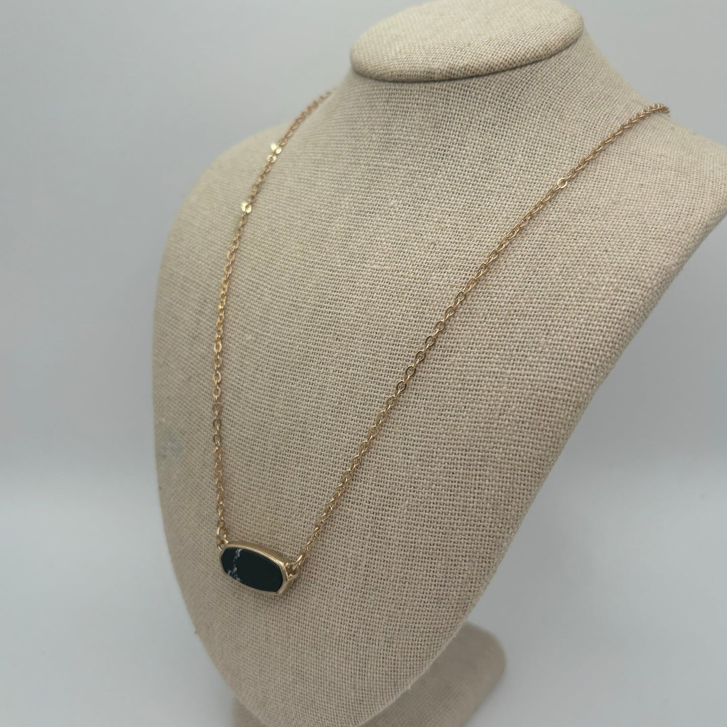 Gold Metal Necklace with Black Oval Pendant
