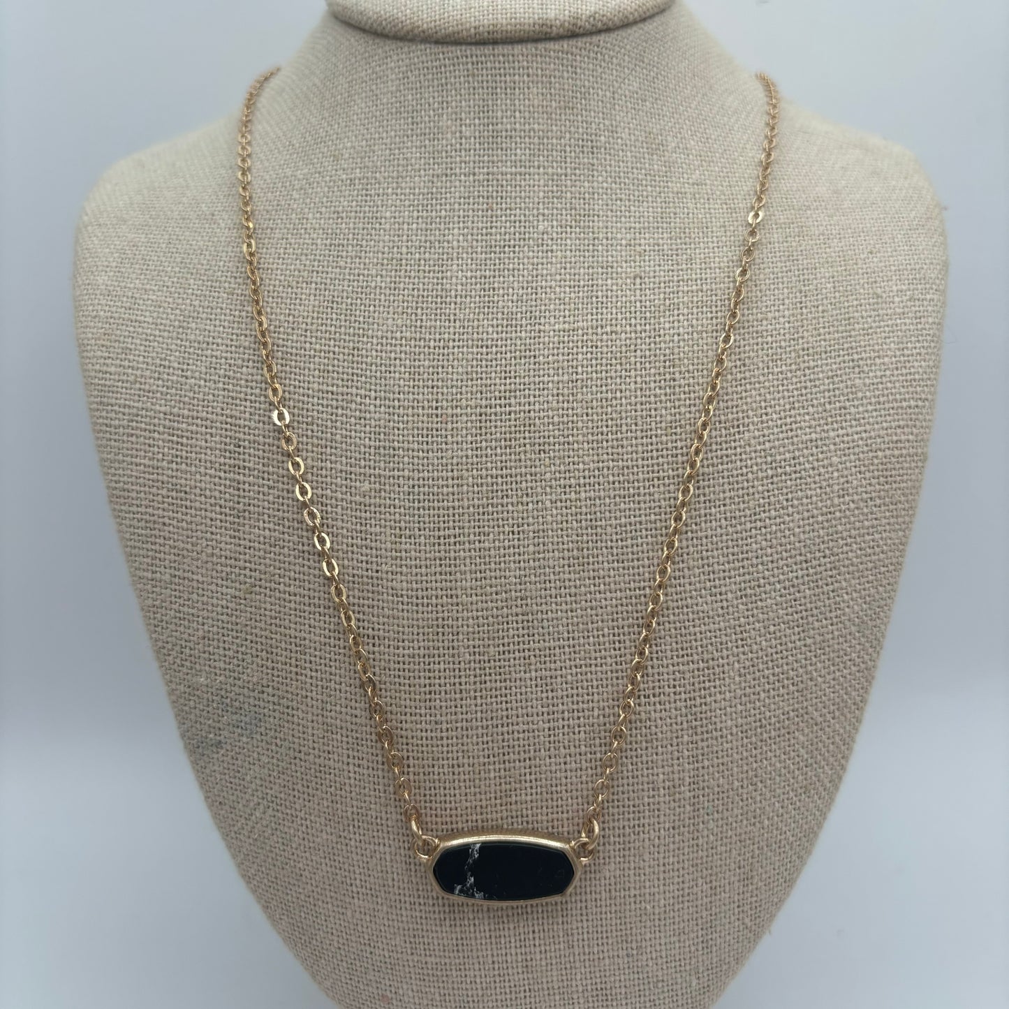 Gold Metal Necklace with Black Oval Pendant