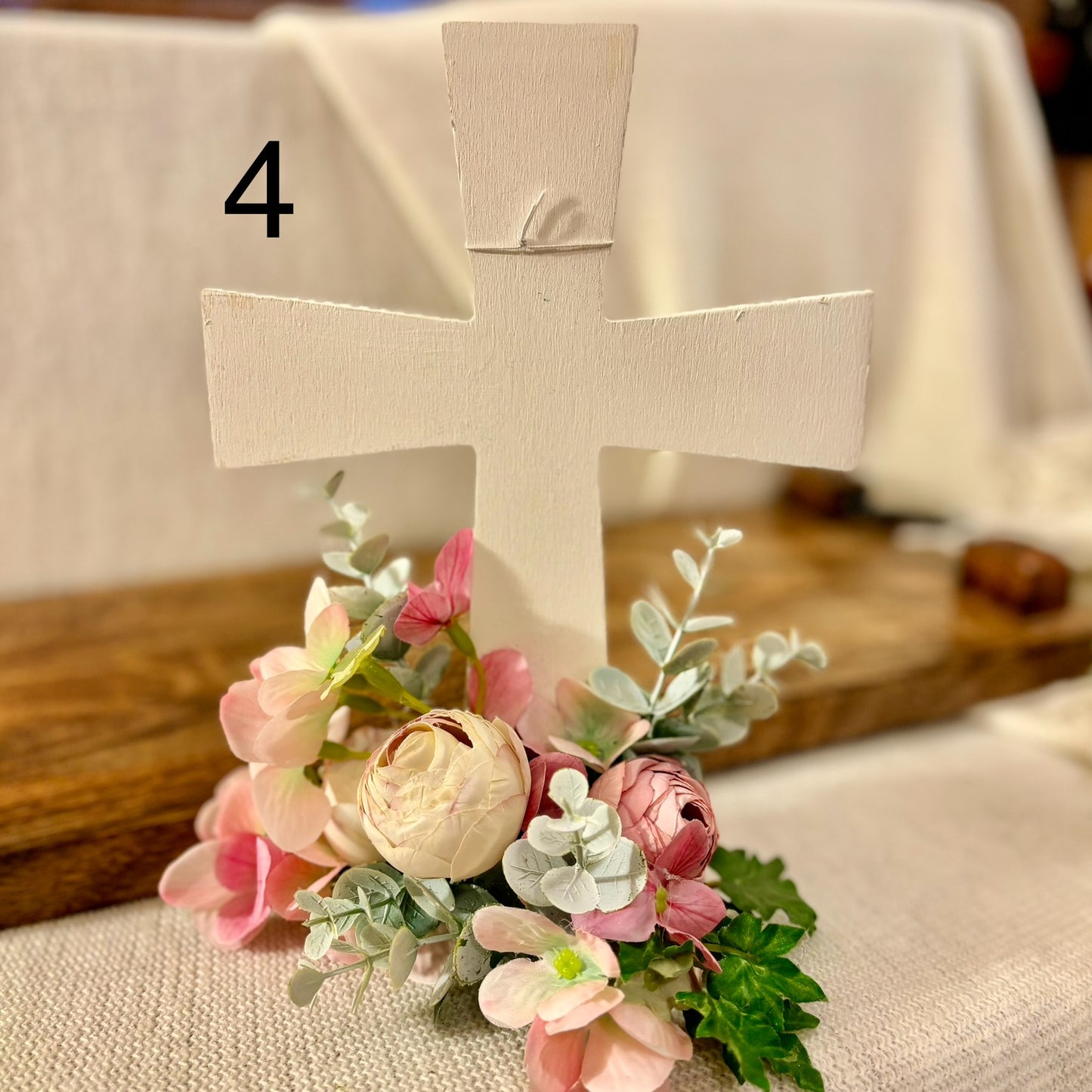 Handmade Stained or Chalk Painted Wooden Cross with Floral Arrangement at Base