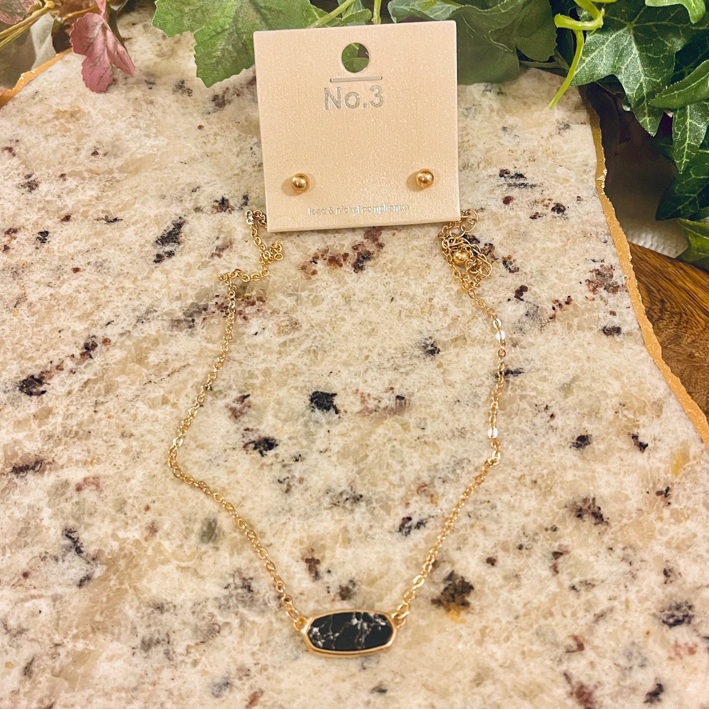 Gold Metal Necklace with Black Oval Pendant