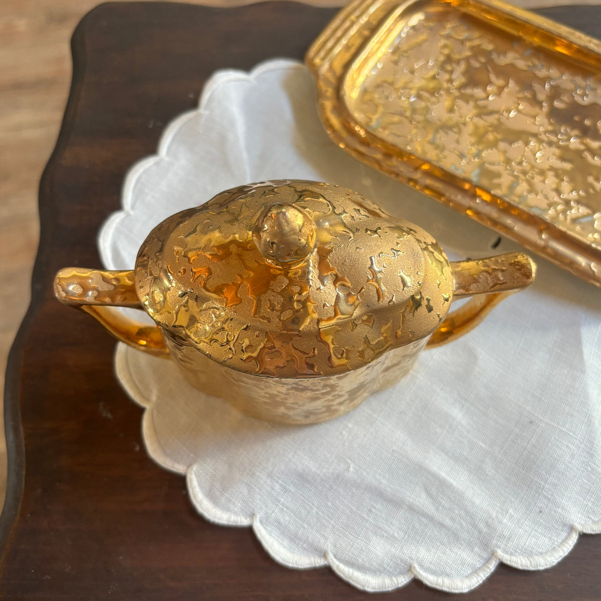 1950s mid-century "weeping bright gold" ceramic creamer and sugar set with a matching tray.