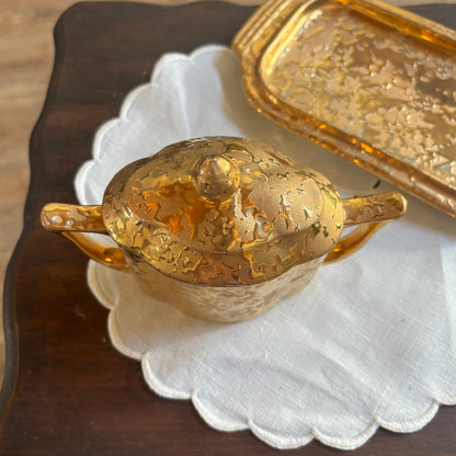 1950s mid-century "weeping bright gold" ceramic creamer and sugar set with a matching tray.