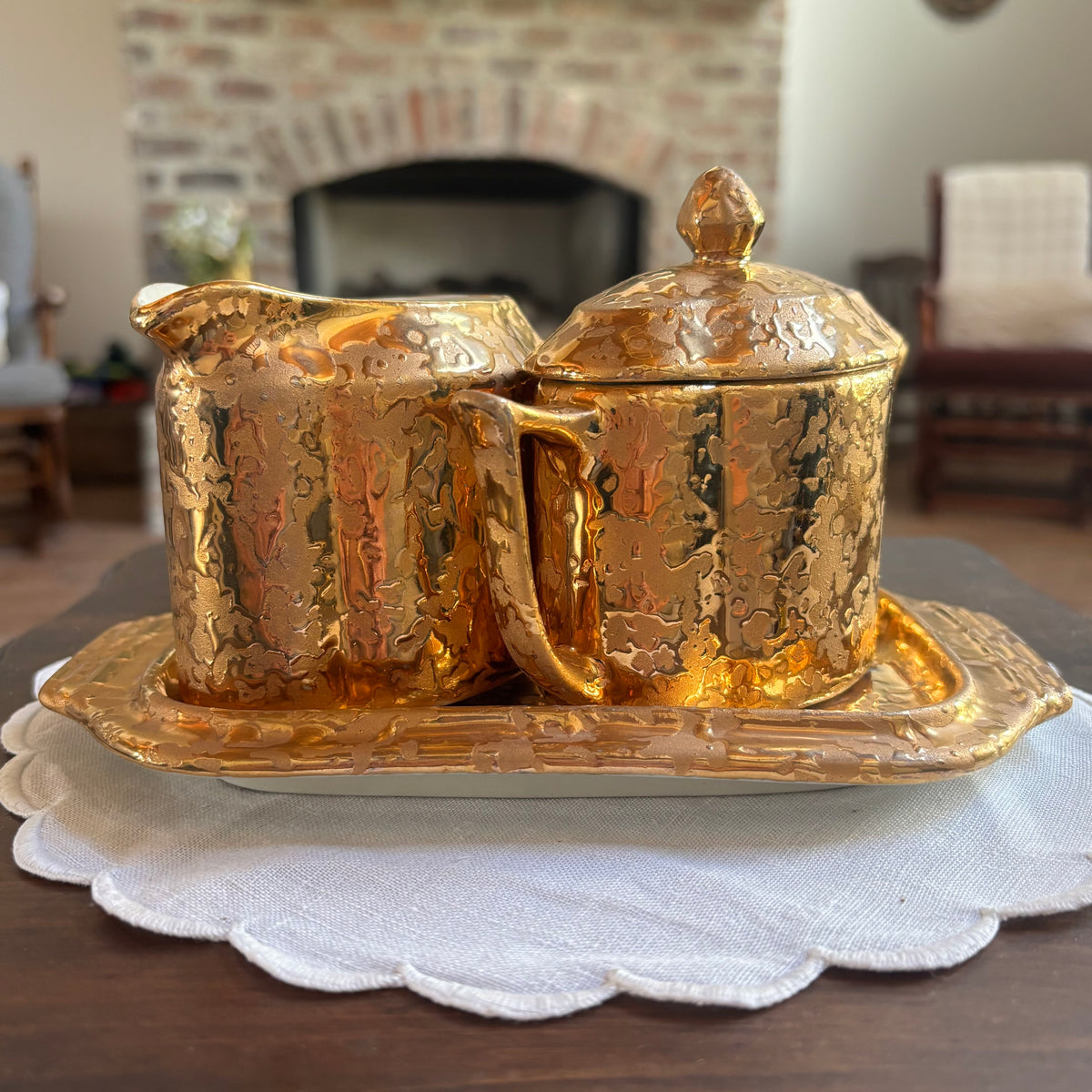 1950s mid-century "weeping bright gold" ceramic creamer and sugar set with a matching tray.