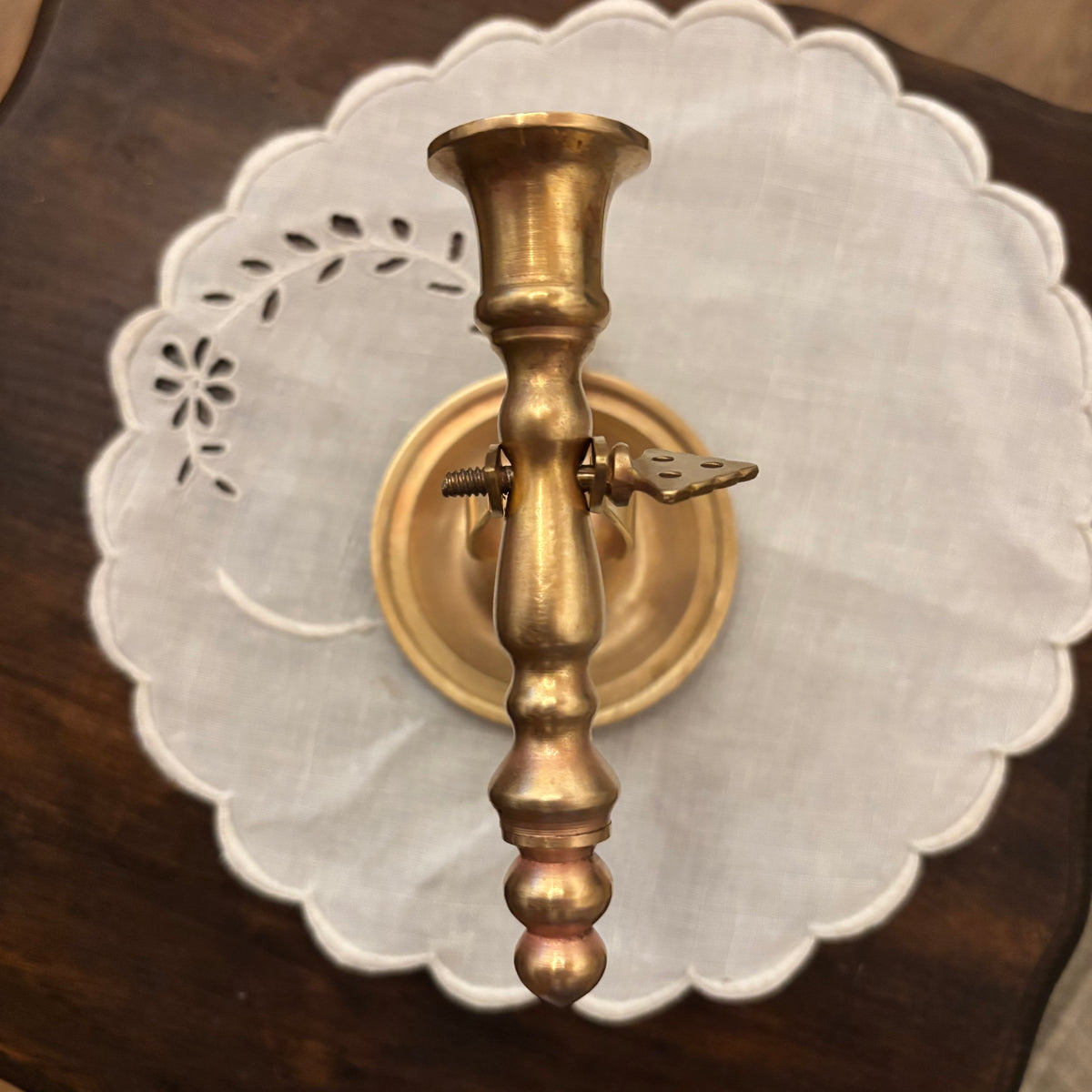 Brass Chamberstick Doubles as a Wall Sconce