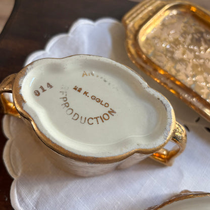 1950s mid-century "weeping bright gold" ceramic creamer and sugar set with a matching tray.