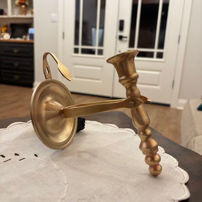 Brass Chamberstick Doubles as a Wall Sconce