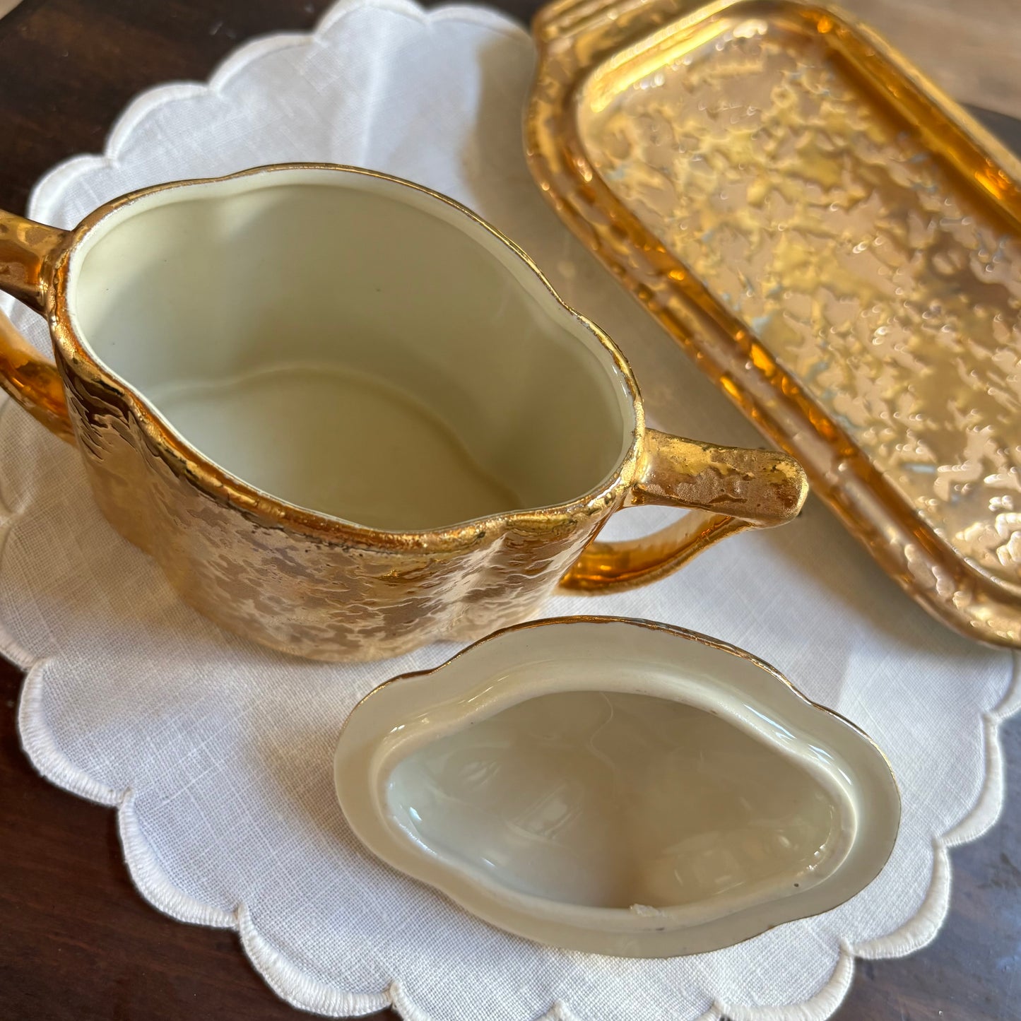 1950s mid-century "weeping bright gold" ceramic creamer and sugar set with a matching tray.