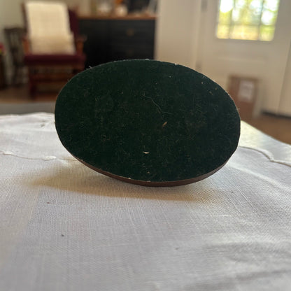 Small Brass Ducks on Wood Surface