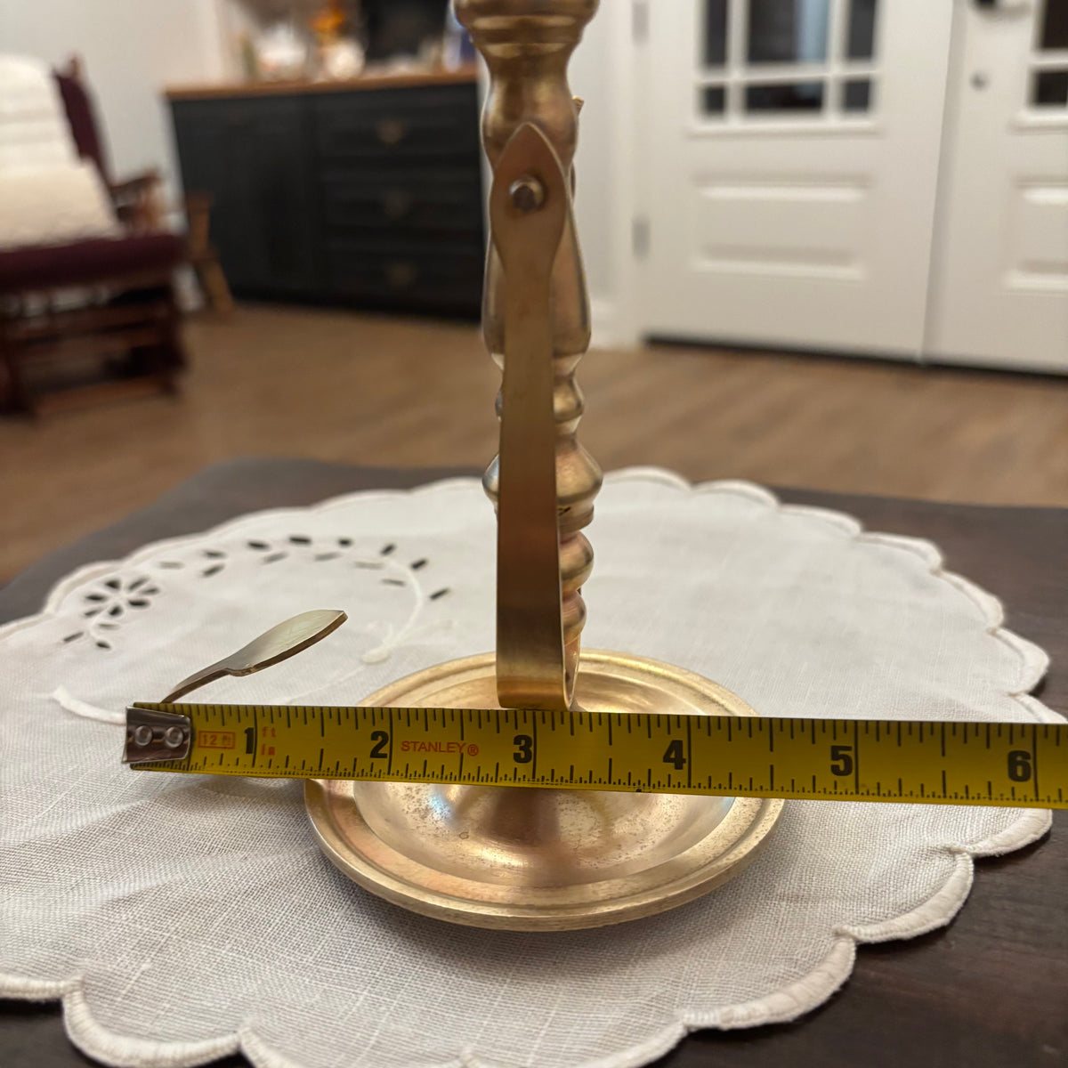 Brass Chamberstick Doubles as a Wall Sconce