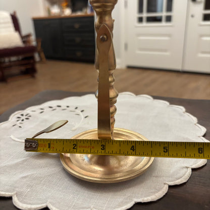 Brass Chamberstick Doubles as a Wall Sconce