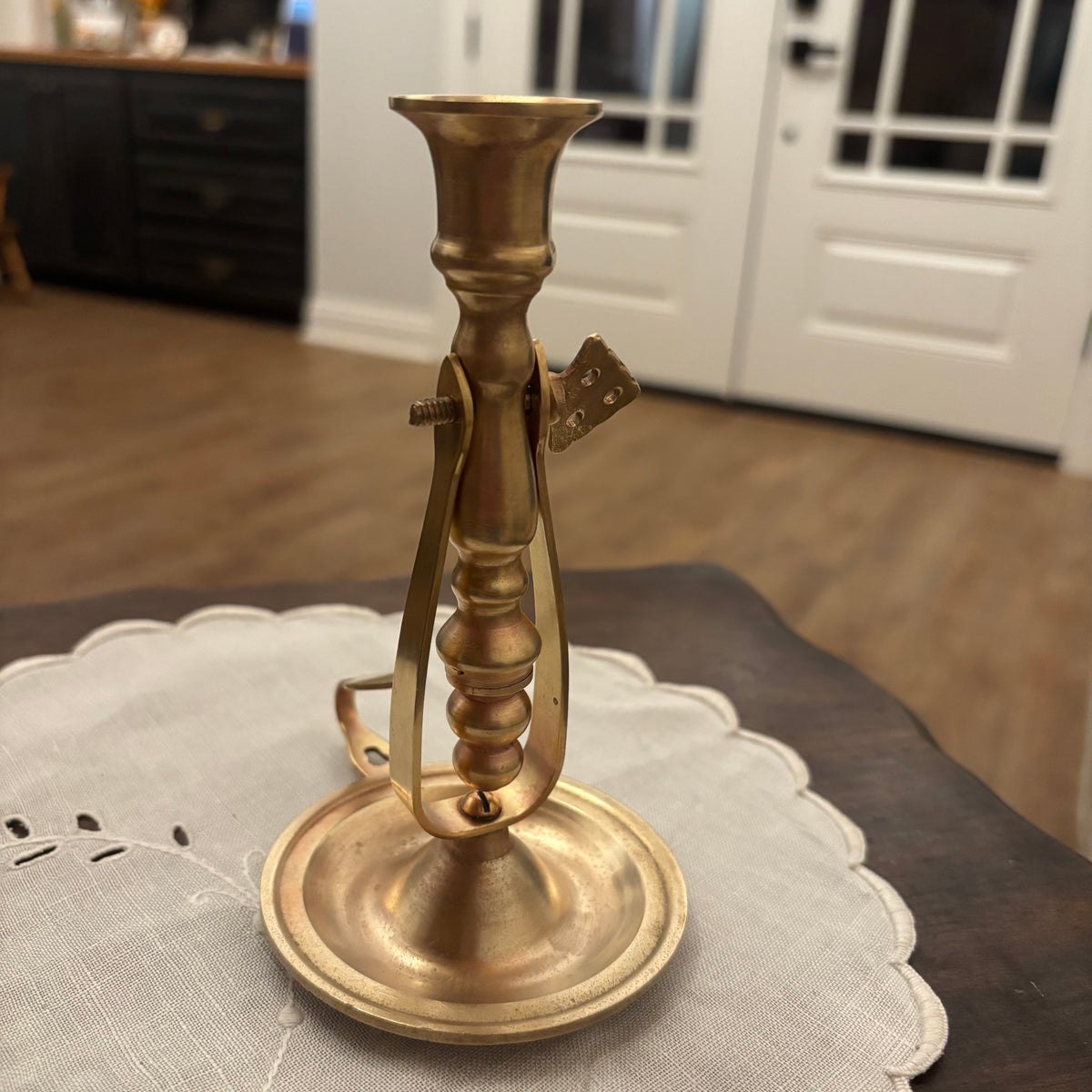 Brass Chamberstick Doubles as a Wall Sconce