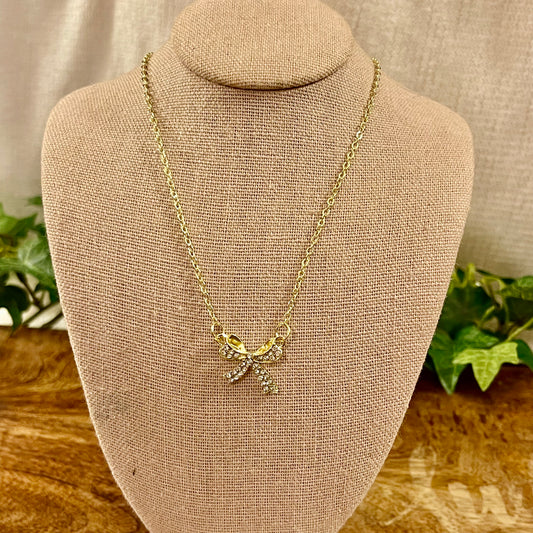 Gold Tone Necklace Featuring Rhinestone Encrusted Bow